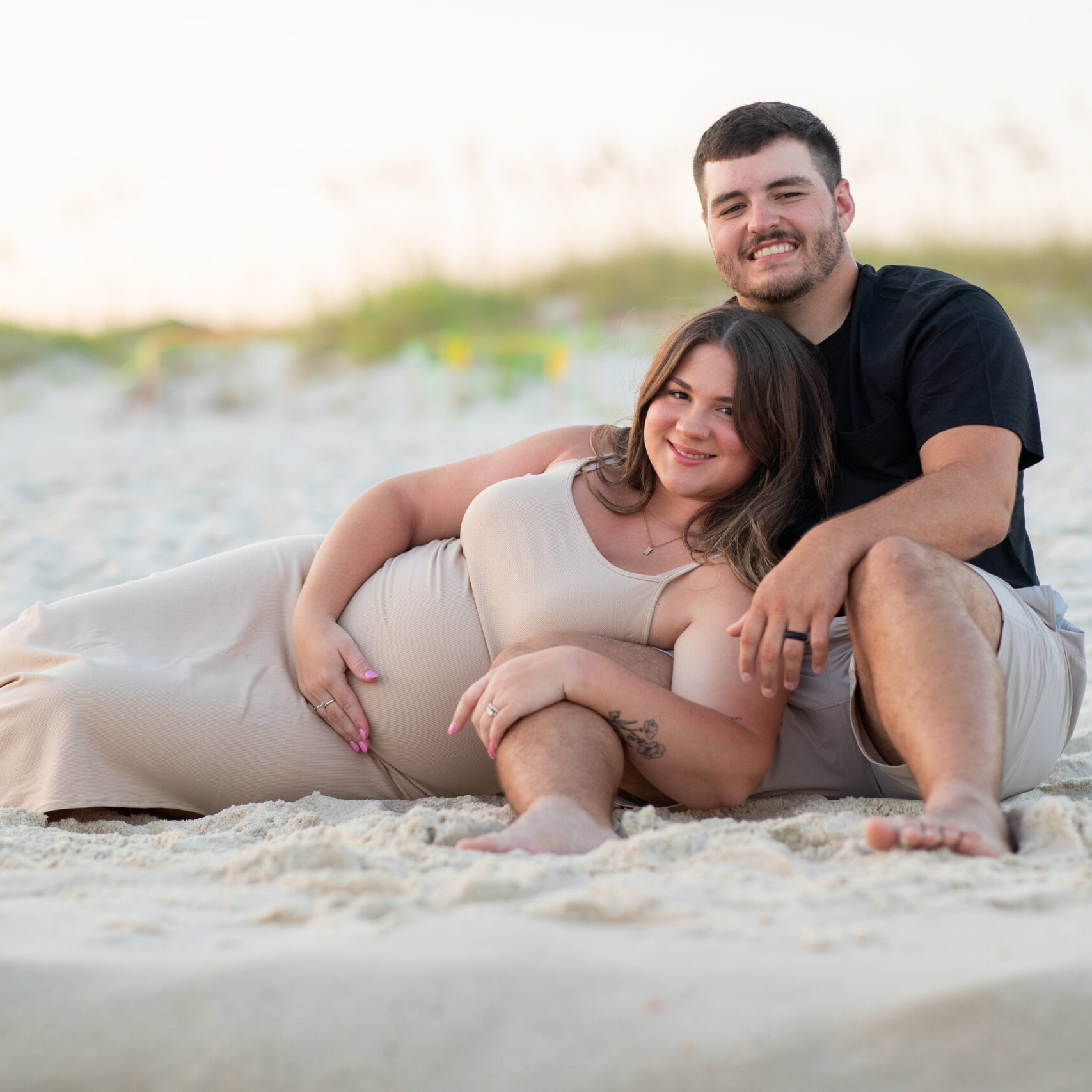 Couple posing in the dunes at Panama City Beach