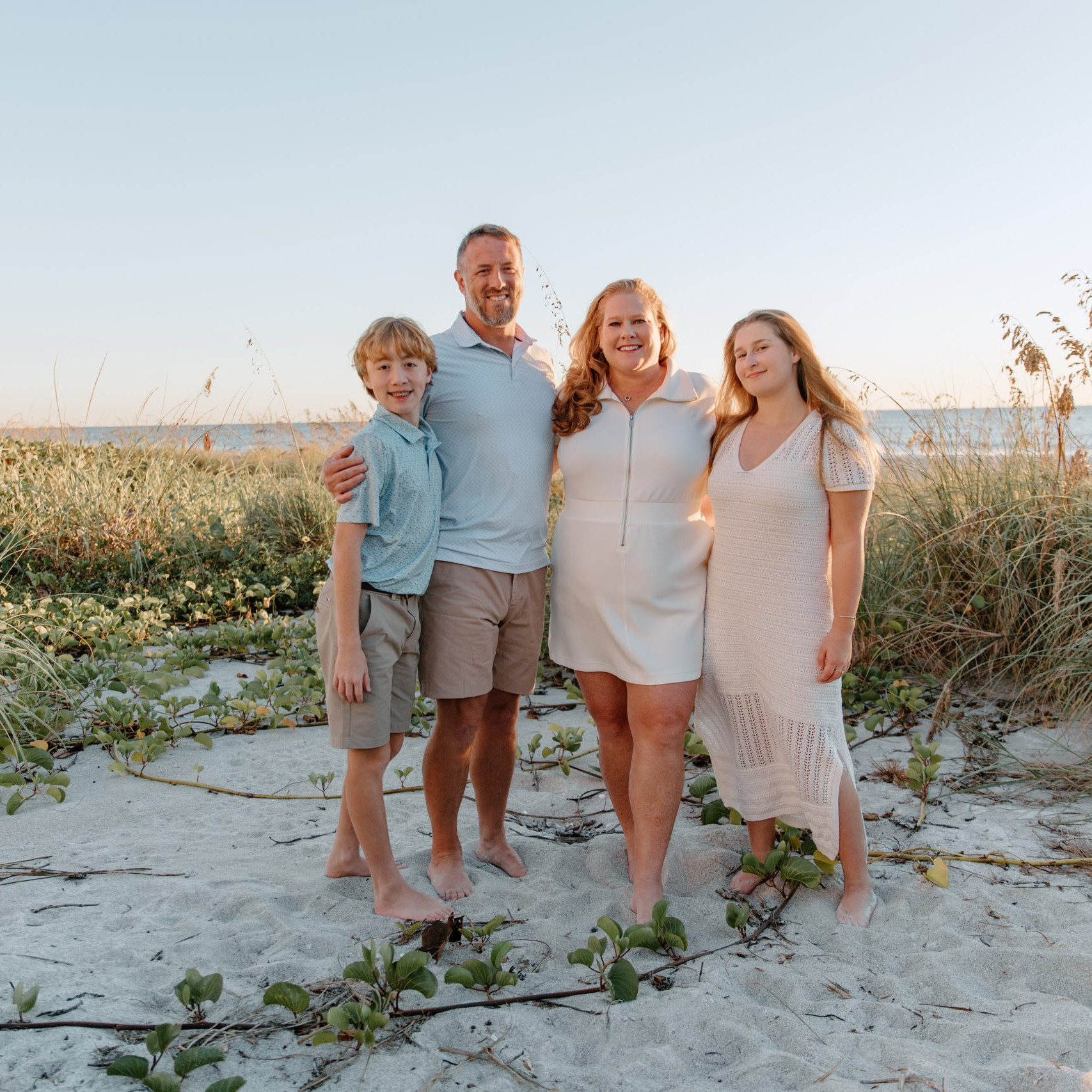 Extended family group photo on the white sand of Indian Rocks Beach, Florida.